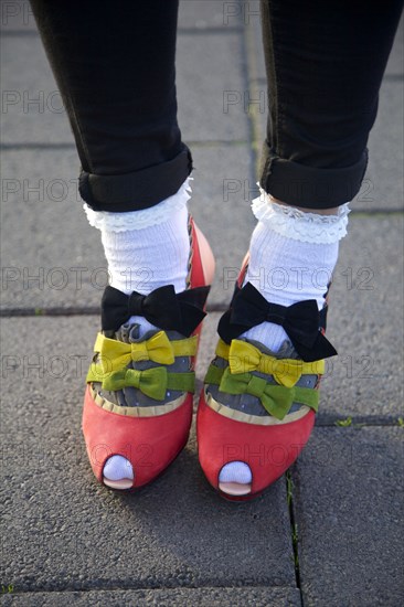 Close up of girl wearing bows on shoes