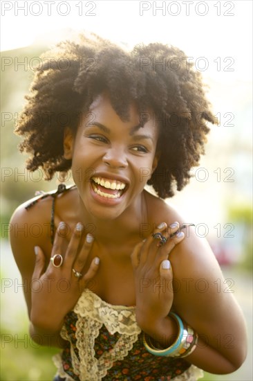 Smiling woman laughing outdoors