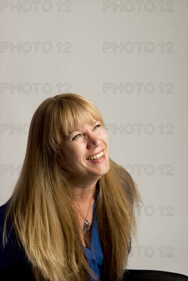 Smiling Caucasian woman looking up