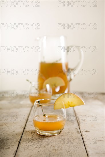 Close up of apple cider glass with garnish