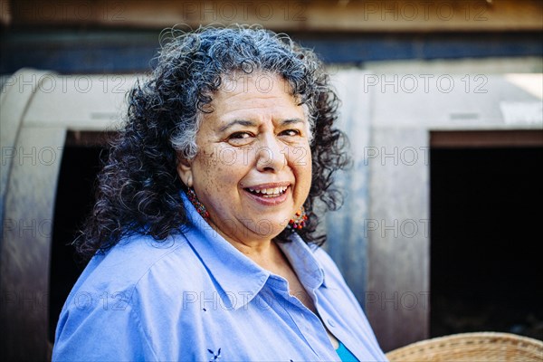 Hispanic woman smiling outdoors