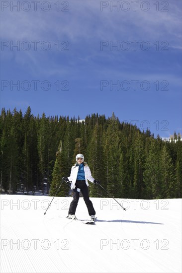 Woman skiing on snowy slope