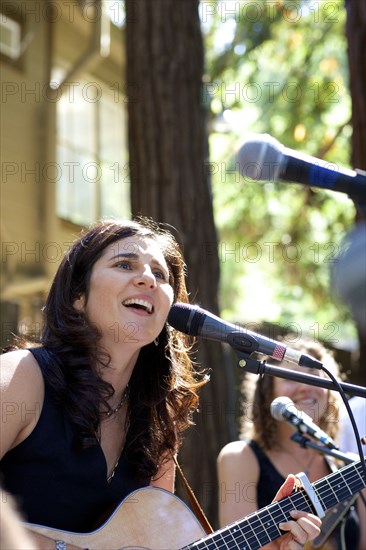 Musicians performing on stage outdoors