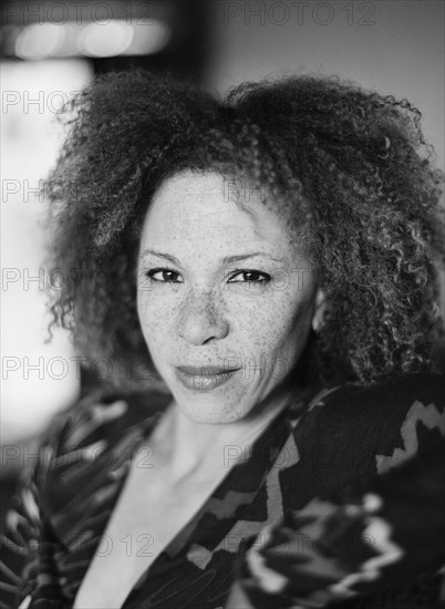 Close up of serious woman with curly hair