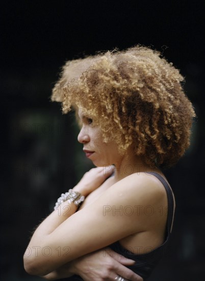 Close up of woman hugging her chest