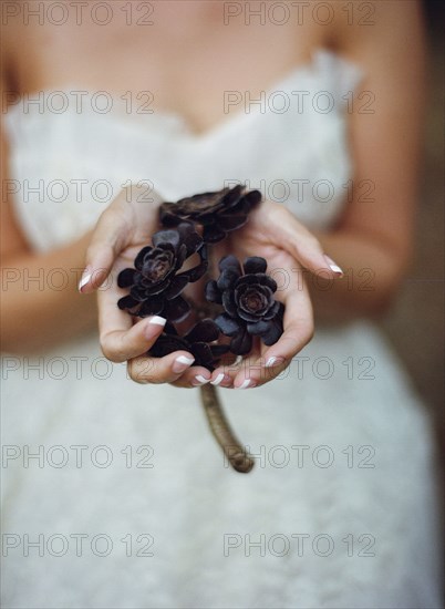Close up of bride holding flowers