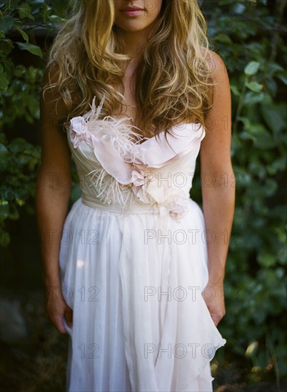 Bride wearing wedding dress in garden