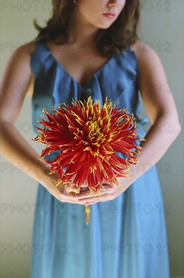 Close up of woman holding flower