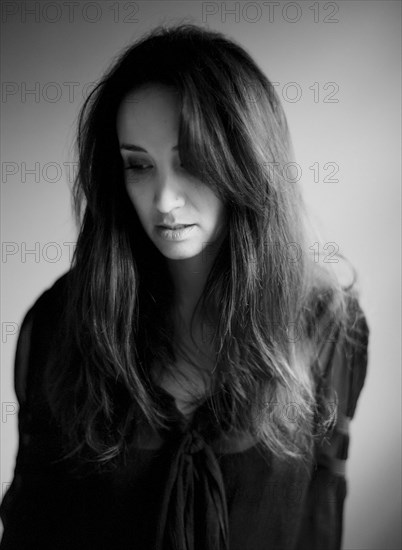 Close up of serious woman with long hair