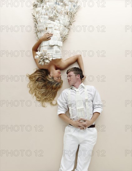 Caucasian couple laying on floor