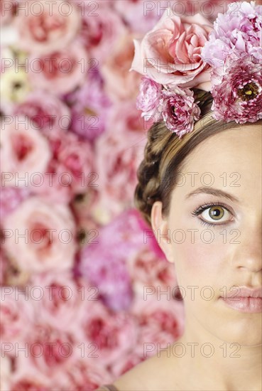 Serious woman wearing flowers in her hair