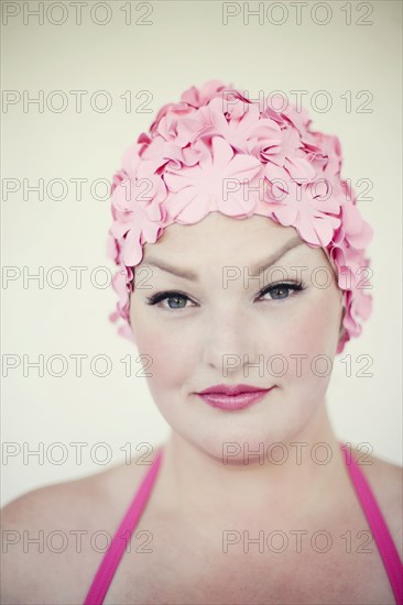 Woman wearing swim cap and bathing suit