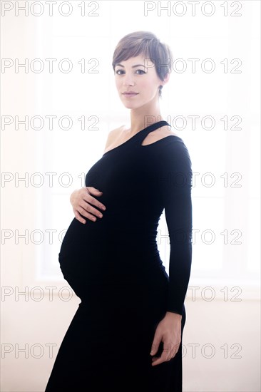 Pregnant woman wearing evening gown