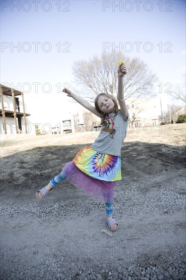 Caucasian girl playing in park