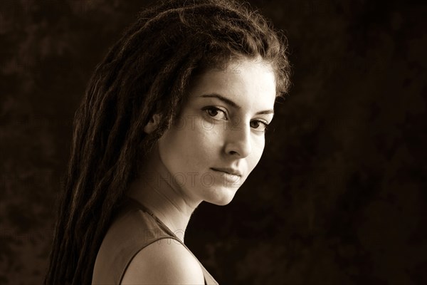 Close up of serious woman with dreadlocks