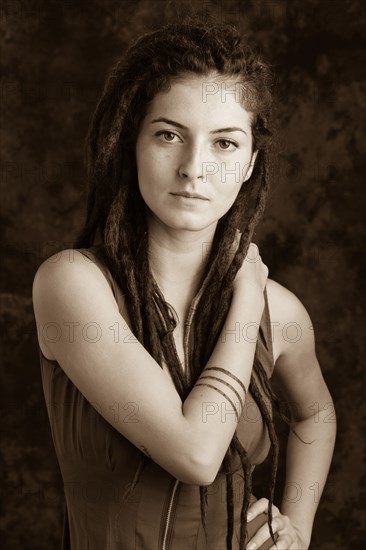 Close up of serious woman with dreadlocks