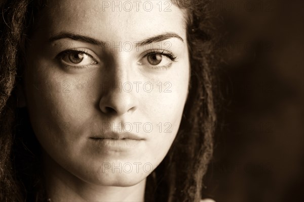 Close up of serious woman with dreadlocks