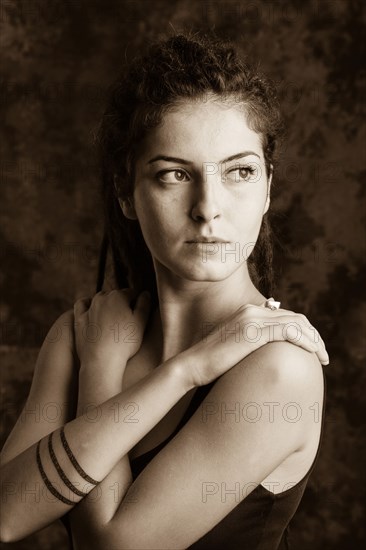 Close up of serious woman with dreadlocks