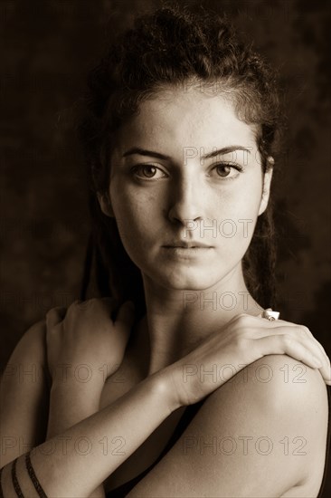 Close up of serious woman with dreadlocks