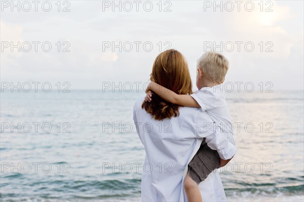 Mother and son admiring ocean