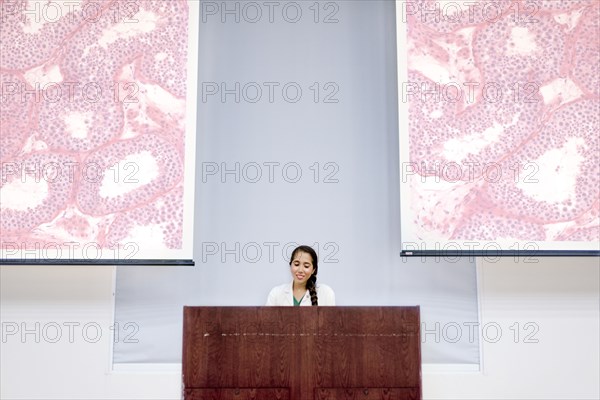 Armenian doctor speaking at podium