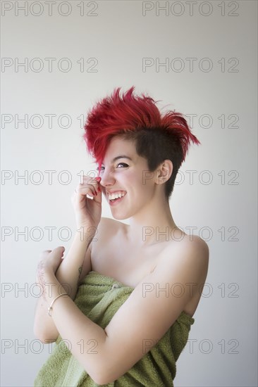 Caucasian woman wrapped in towel