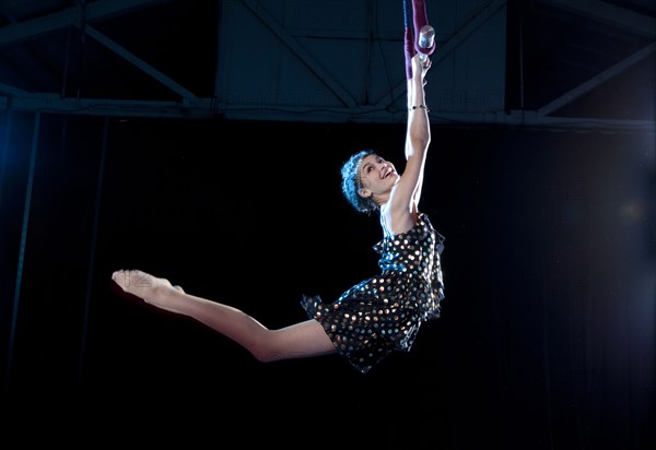 Mixed race acrobat performing