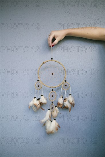 Hand holding dream catcher