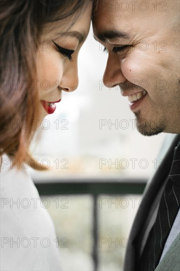 Japanese couple touching foreheads