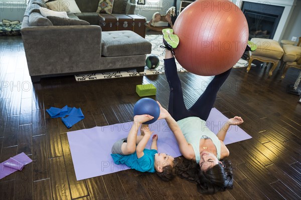 Mother and son playing with exercise ball