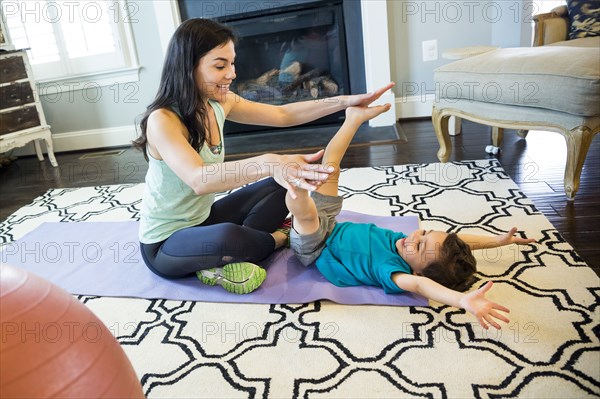 Mother and son playing on floor