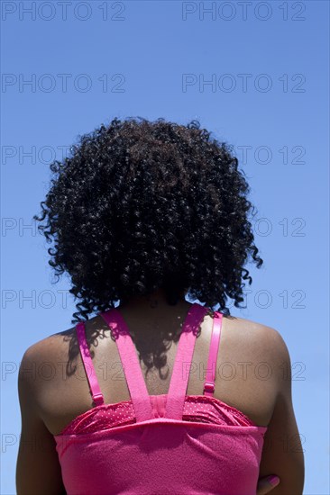 Rear view of woman with curly hair