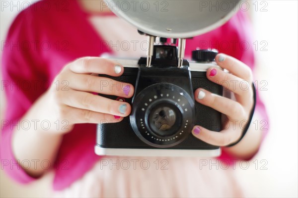 Close up of girl holding camera