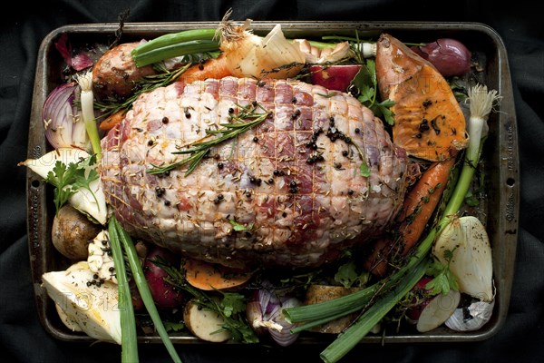 Pan of meat and vegetables with herbs