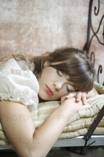 Caucasian woman sleeping on bed