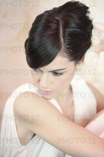 Caucasian woman looking over her shoulder