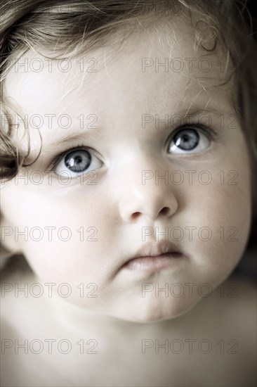Close up of Caucasian girl looking up