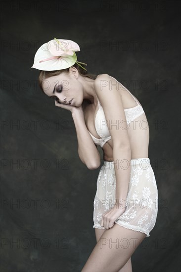 Woman in lingerie wearing flowers in her hair