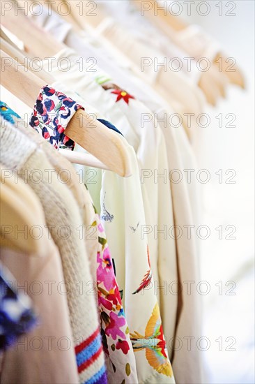 Close up of shirts on hangers