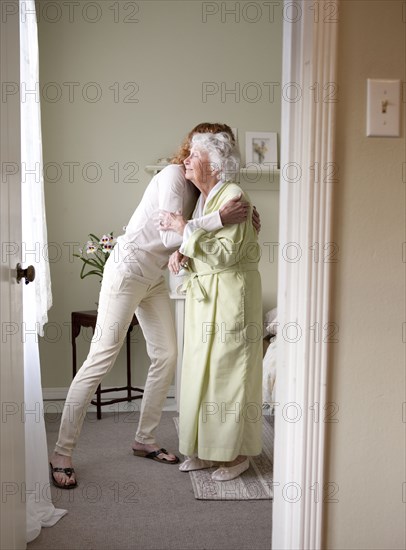 Mother and daughter hugging