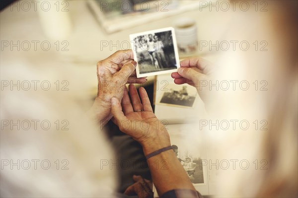 Women looking at family photographs