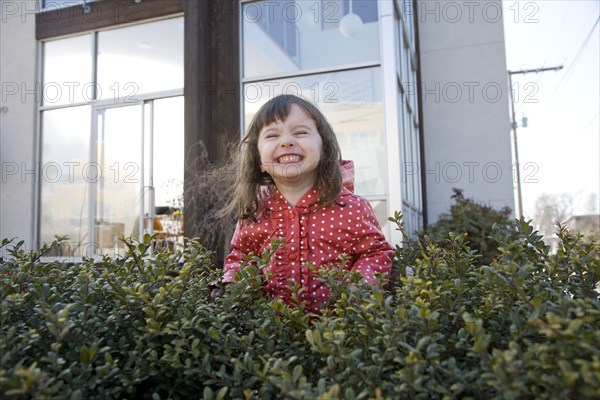 Caucasian girl smiling in bush