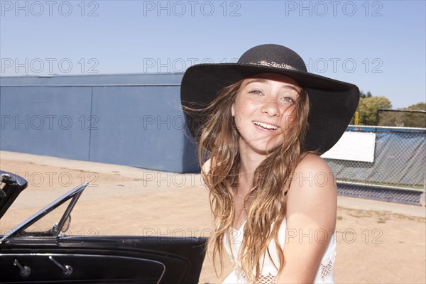 Teenage girl smiling outdoors