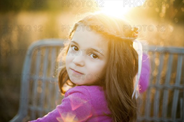 Caucasian girl standing in field