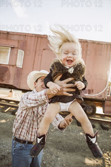 Father and daughter playing outdoors