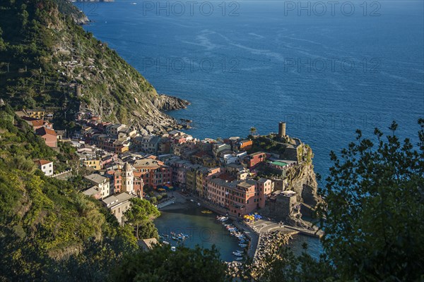 Aerial view of Cinque Terre cityscape and ocean cliffs