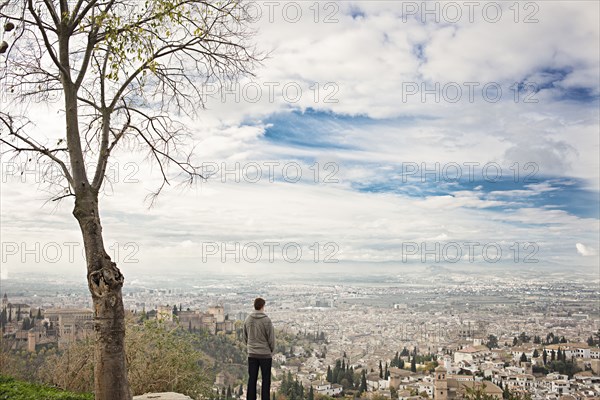 Man admiring scenic view of cityscape