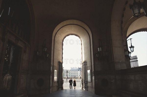 Caucasian couple standing in church archway