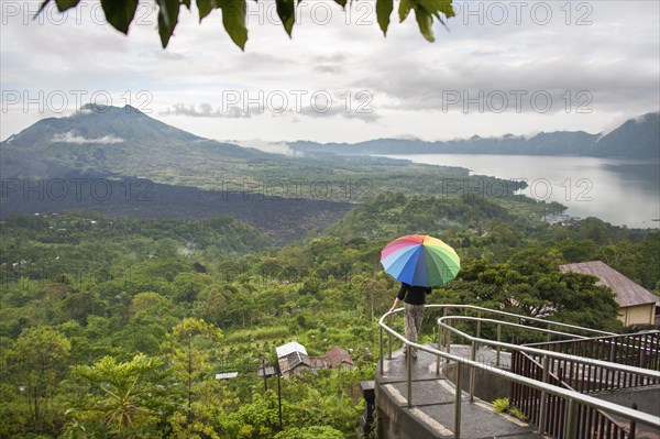 Caucasian tourist admiring scenic view of jungle