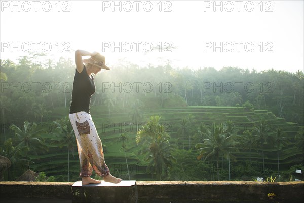 Caucasian tourist over rural rice terrace